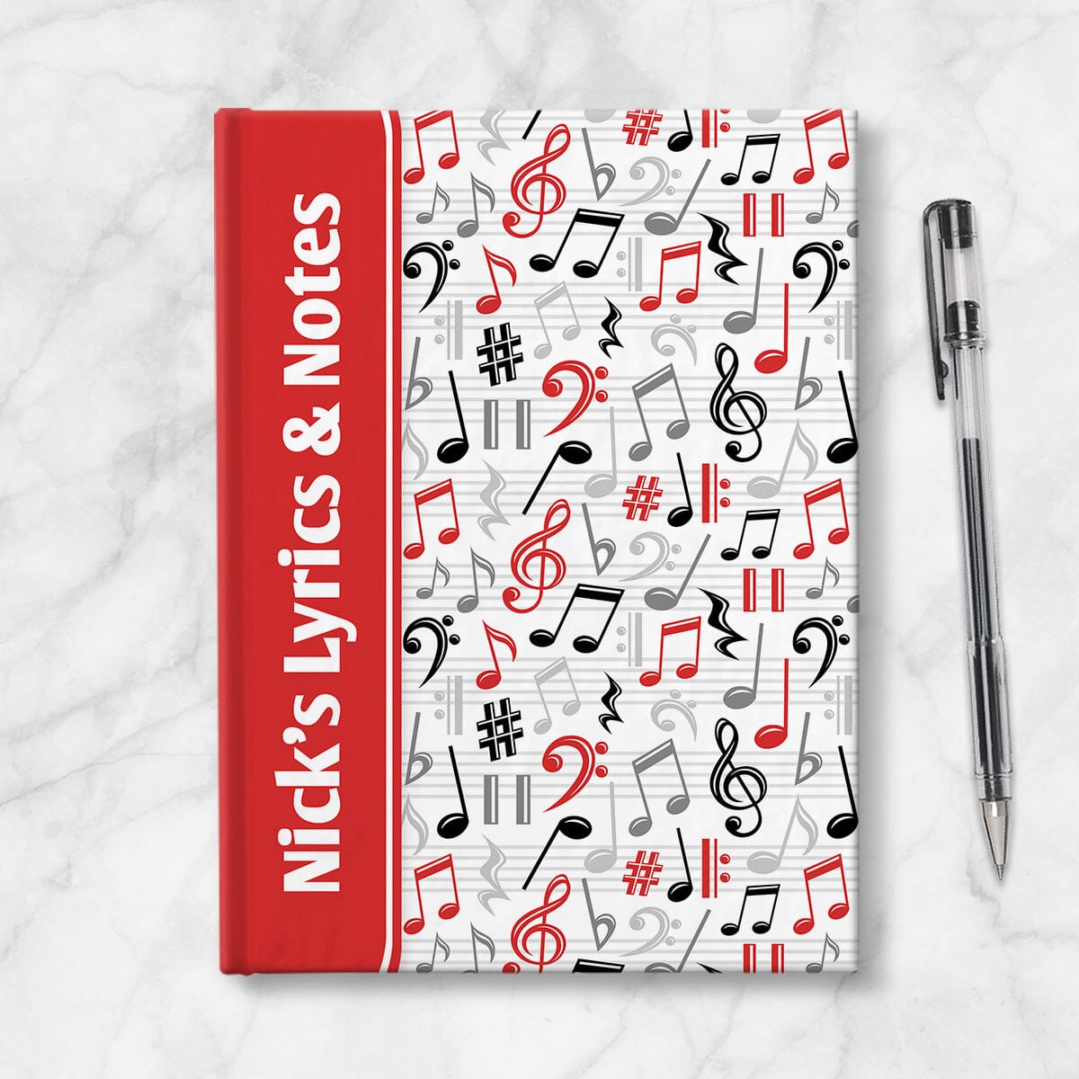 Personalized Red Music Notes Pattern Journal at Artistically Invited. A custom book designed with a red color wrapping around the spine area over an energetic pattern of red, black, and gray music notes and symbols on the rest of the background. Your personalized name and text of your choice is custom printed sideways in white over the red color on the front near the spine. Image shows the book next to a pen.