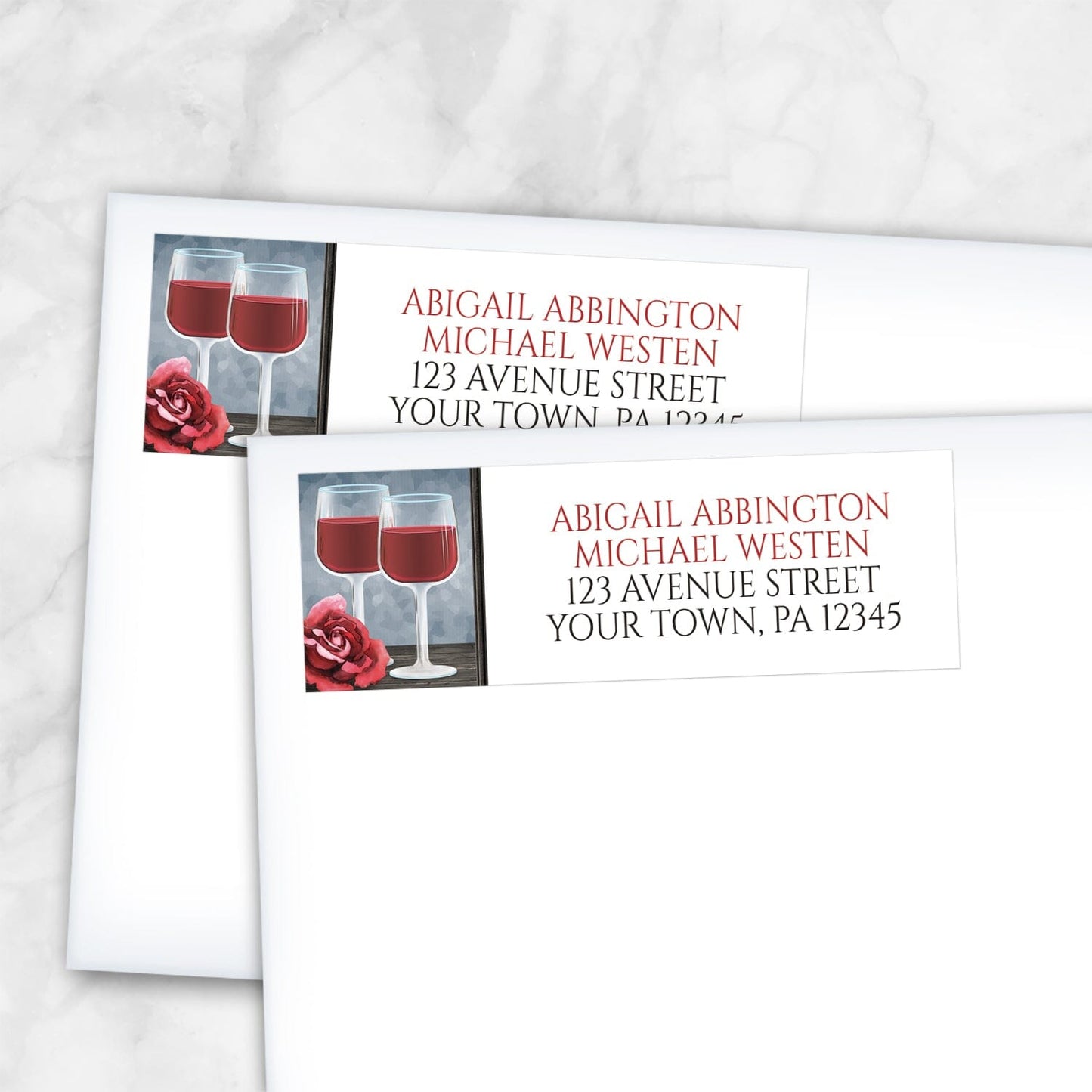 2 Red Wine Glasses Floral Rose Address Labels shown on white envelopes on a marble surface