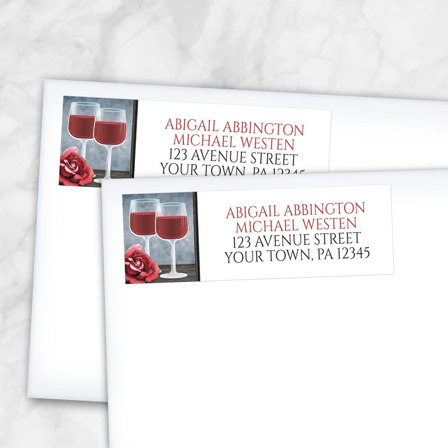 2 Red Wine Glasses Floral Rose Address Labels shown on white envelopes on a marble surface