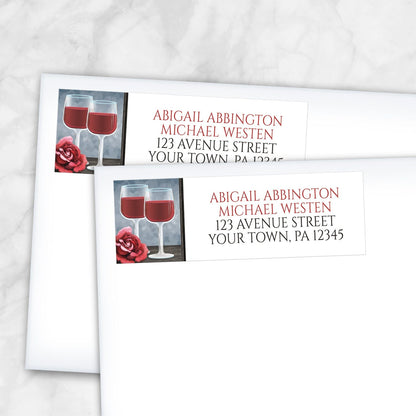 2 Red Wine Glasses Floral Rose Address Labels shown on white envelopes on a marble surface