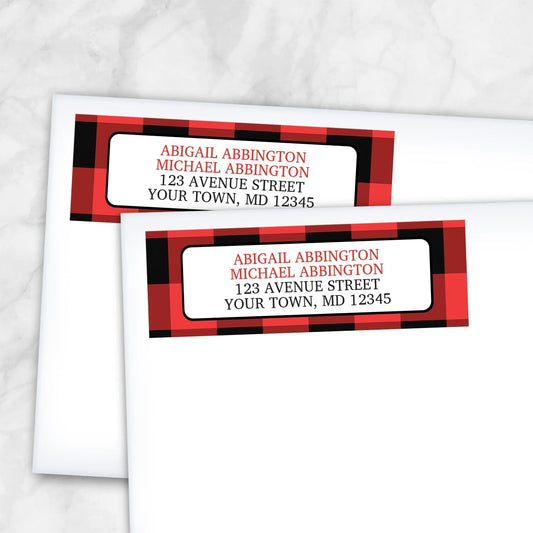 2 Red and Black Buffalo Plaid Address Labels shown on white envelopes on a marble surface