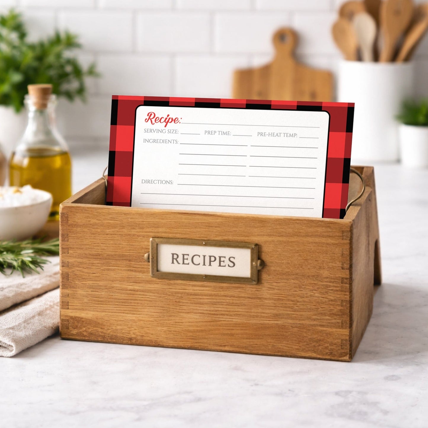 Wooden recipe box with a Red and Black Buffalo Plaid Recipe Card on a kitchen counter.