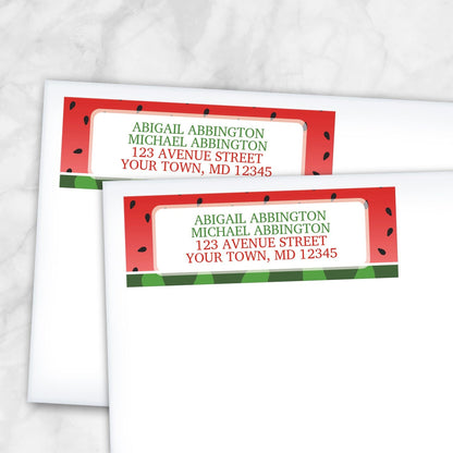 2 Red and Green Watermelon Address Labels shown on white envelopes on a marble surface