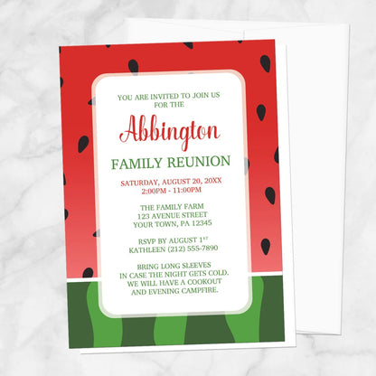 Red and Green Watermelon Family Reunion Invitation shown on a marble surface with a white envelope.