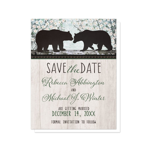 Rustic Bear Floral Wood Save the Date Cards at Artistically Invited. Rustic bear floral wood save the date cards with two silhouette bears on a wooden tree trunk-like stripe over a whimsical spring floral trees illustration. Your personalized wedding date announcement details are custom printed in black and green over a light rustic wood image background.