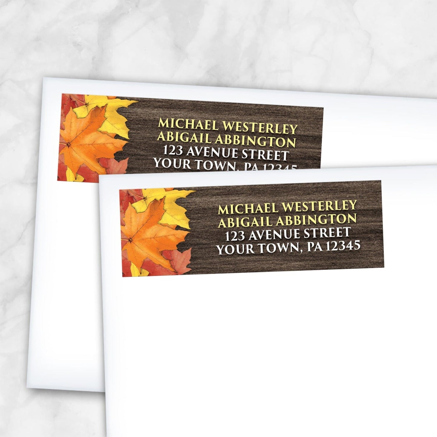 2 Rustic Autumn Leaves Wood Address Labels shown on white envelopes on a marble surface