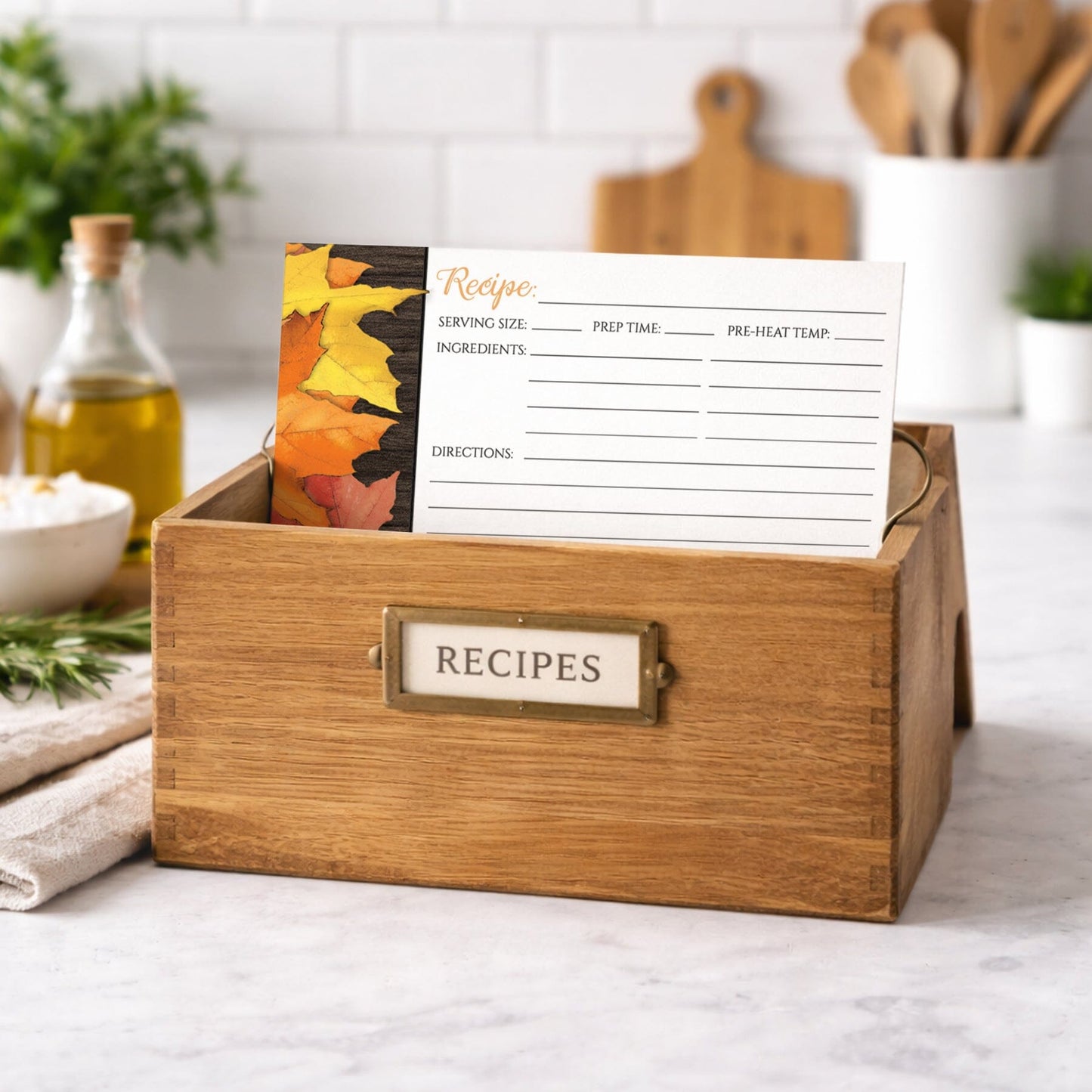 Wooden recipe box with a Rustic Autumn Leaves Wood White Recipe Card on top in a kitchen setting