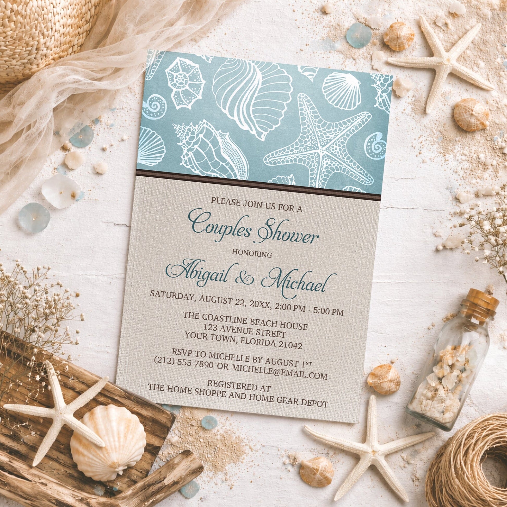 Rustic Beach Linen Seashell Couples Shower Invitation shown on a light rustic surface with seashells, sand, drift wood, and coastal decor.