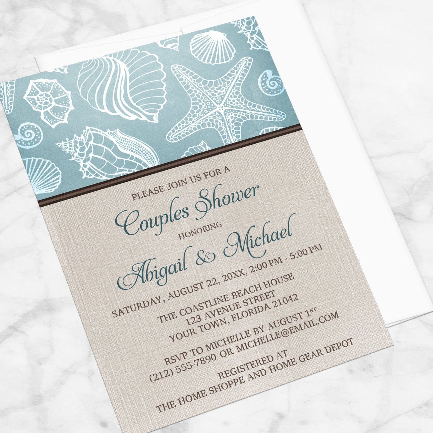 Rustic Beach Linen Seashell Couples Shower Invitation shown at an angle on a marble surface with a white envelope.
