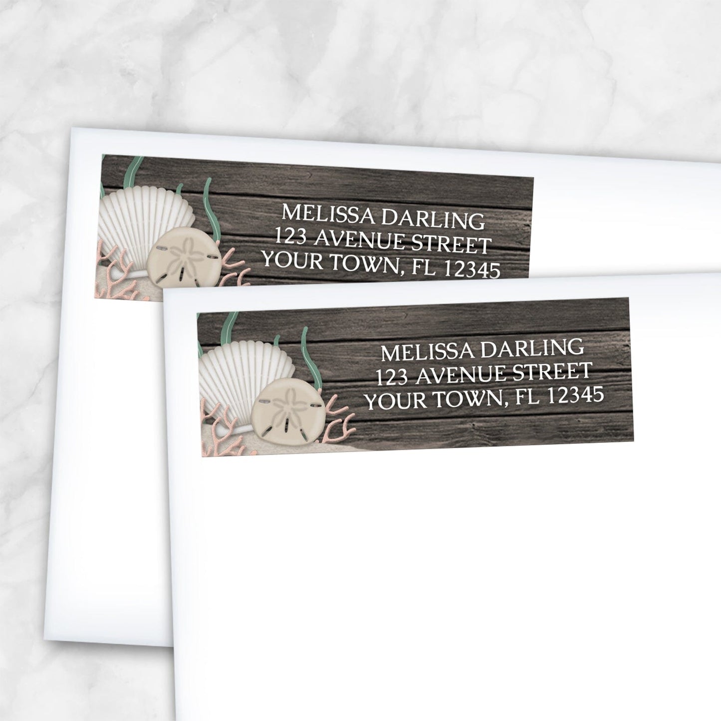2 Rustic Beach Seashells and Wood Address Labels shown on white envelopes on a marble surface
