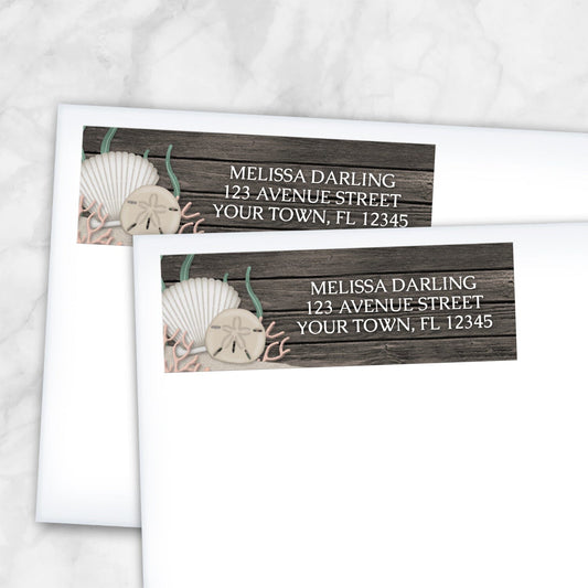 2 Rustic Beach Seashells and Wood Address Labels shown on white envelopes on a marble surface