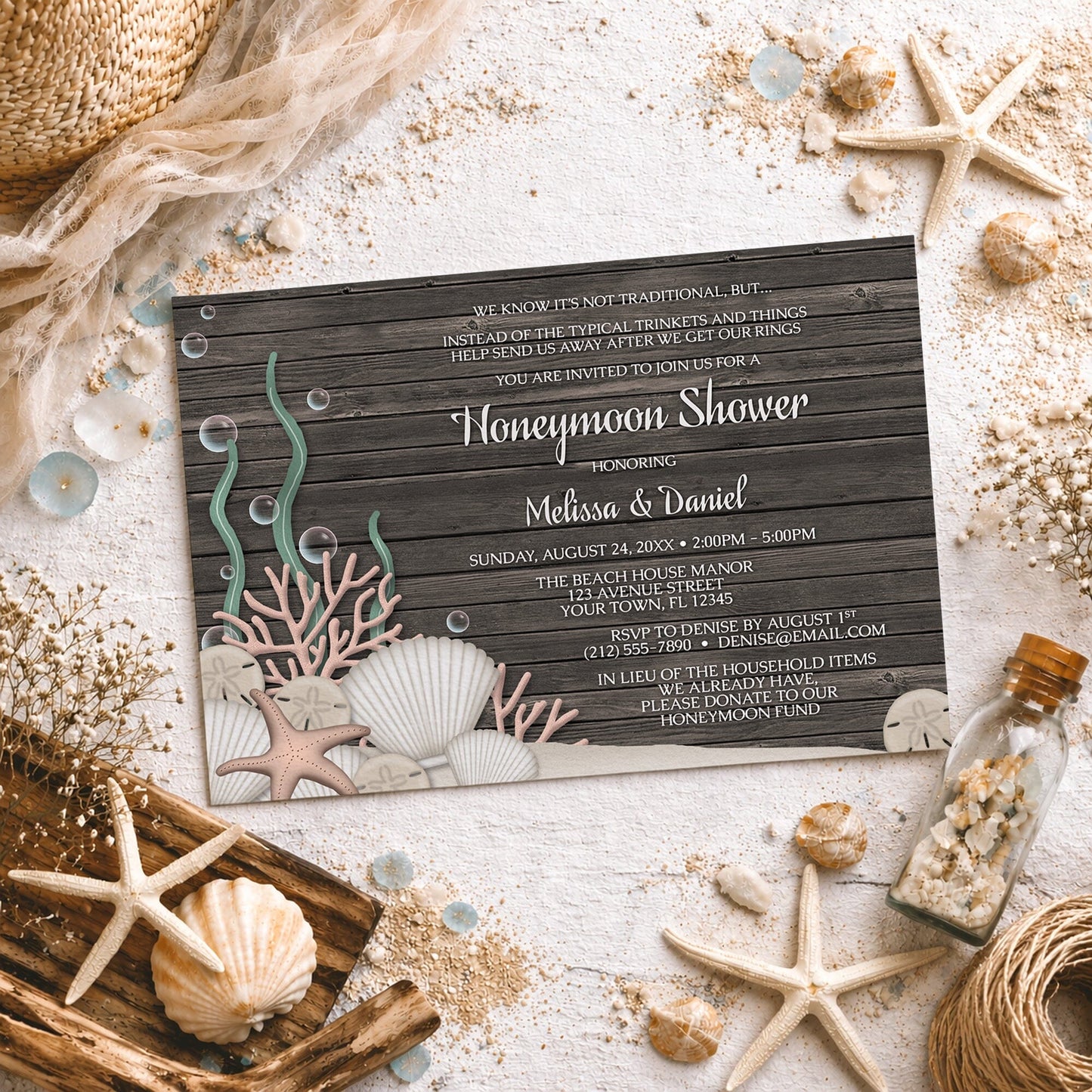 Rustic Beach Seashells and Wood Honeymoon Shower Invitation shown on a light surface with seashells, beach sand, and coastal decor.