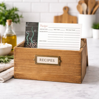 Wooden recipe box with a Rustic Beach Seashells and Wood Recipe Card on a kitchen counter