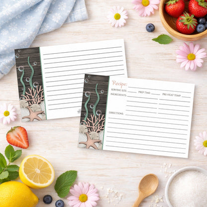 Set of Rustic Beach Seashells and Wood Recipe Cards with ocean-themed design on a wooden surface with spring and summer fruits and flowers.