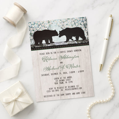 Rustic Bear Floral Wood Couples Shower Invitation shown on a marble surface with a white gift box, pen, ribbon, and pearls.