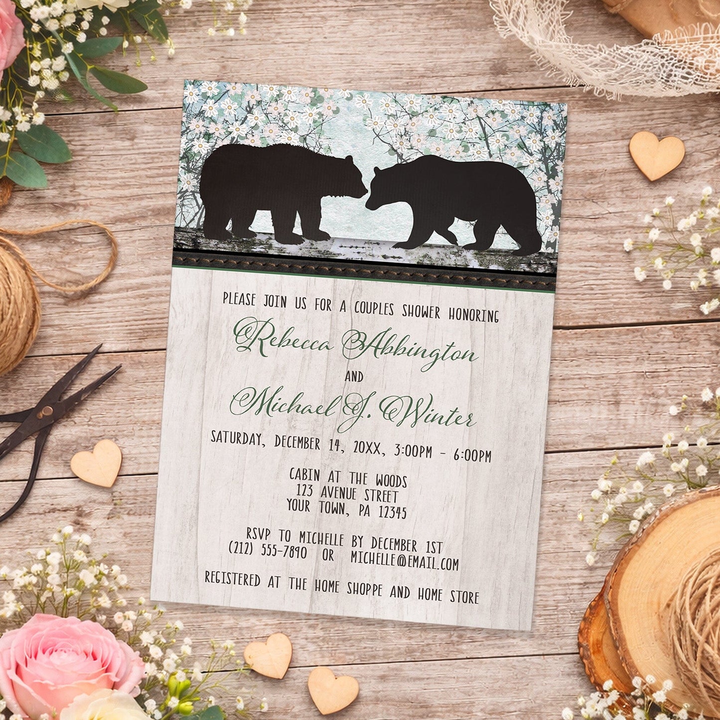 Rustic Bear Floral Wood Couples Shower Invitation shown on a wooden surface with spring and summer flowers, small wood hearts, lace, and twine.
