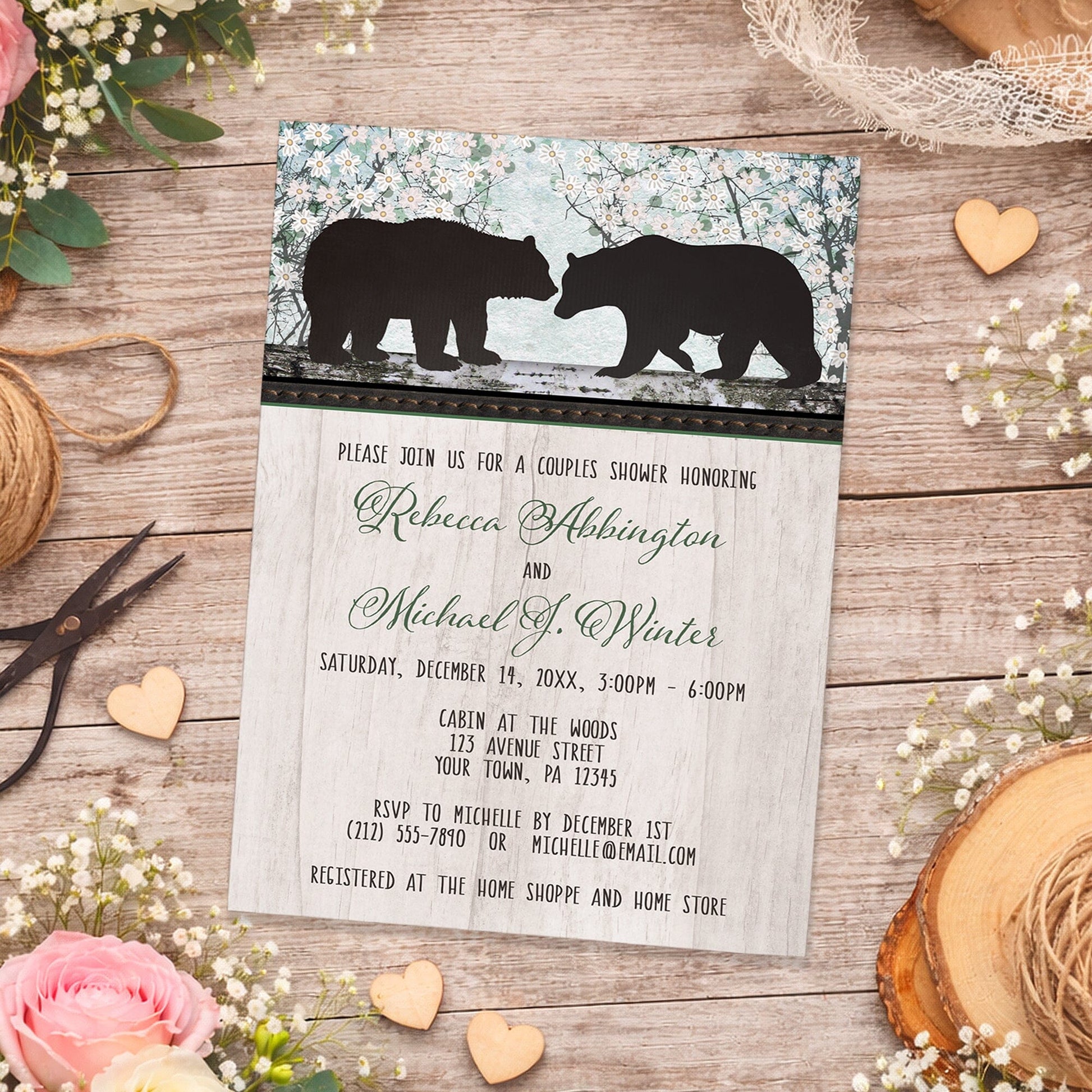 Rustic Bear Floral Wood Couples Shower Invitation shown on a wooden surface with spring and summer flowers, small wood hearts, lace, and twine.