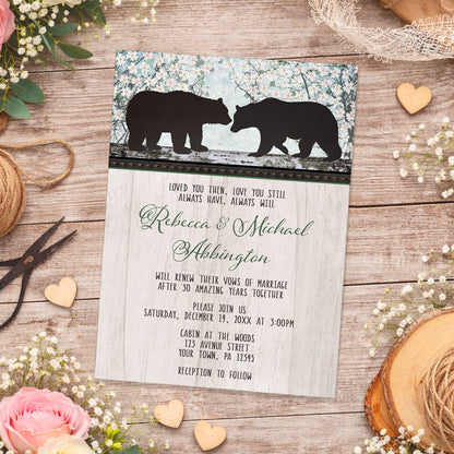 Rustic Bear Floral Wood Vow Renewal Invitation shown on a wooden surface with spring and summer flowers, small wood hearts, lace, and twine.