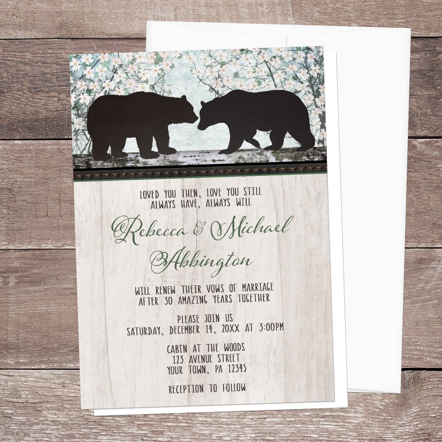 Rustic Bear Floral Wood Vow Renewal Invitation shown on a brown wood surface with a white envelope.