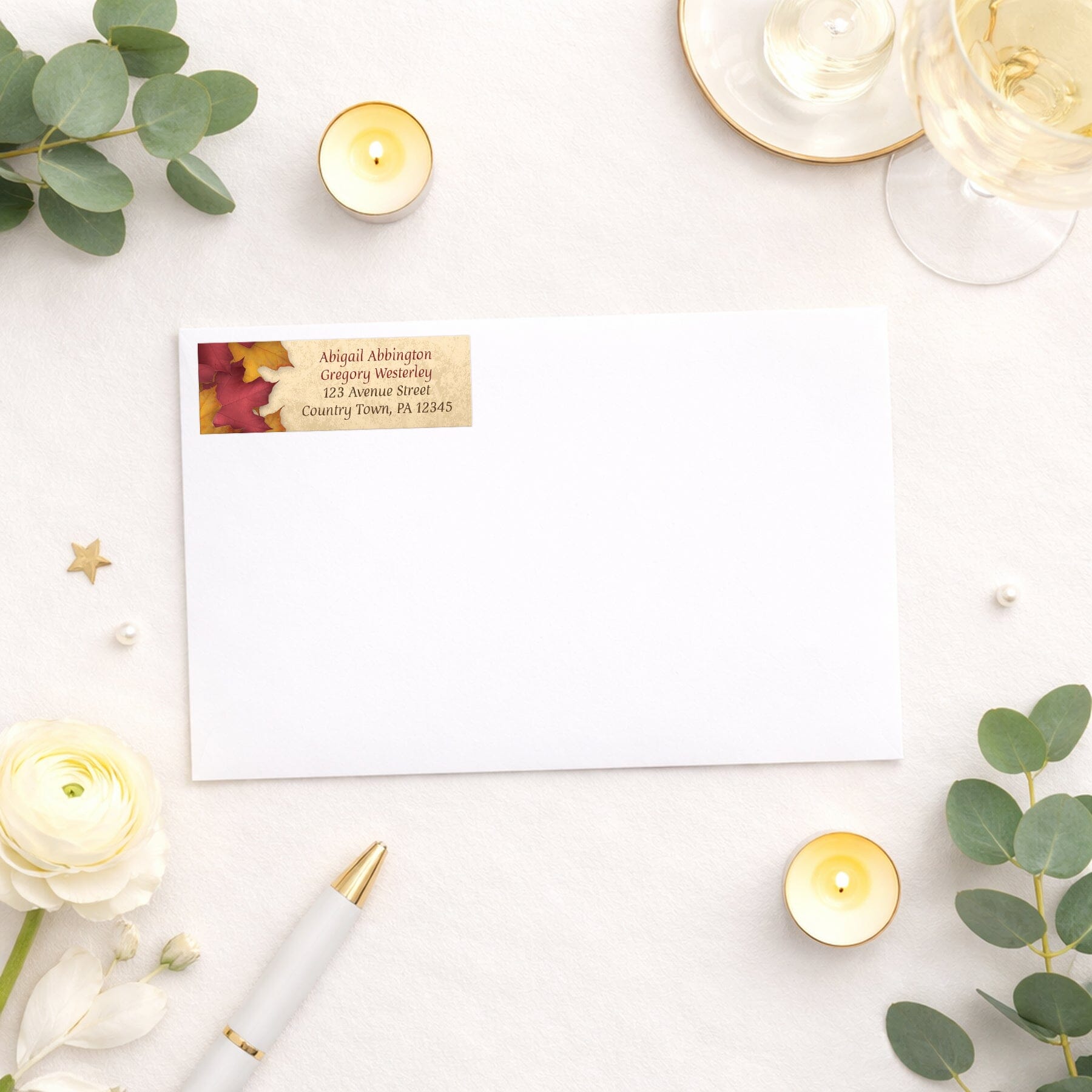 Rustic Burgundy Gold Autumn Address Label shown on a white envelope with wedding and shower supplies