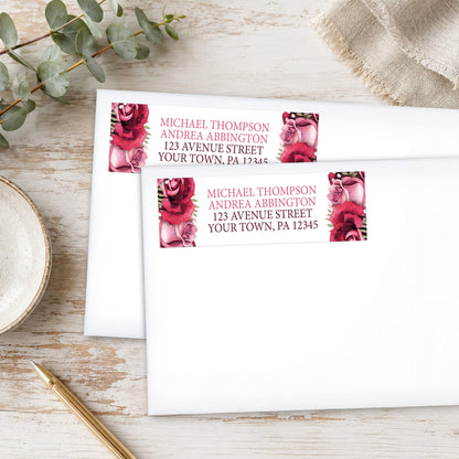 Rustic Burgundy Pink Rose White Address Labels, shown on white envelopes, on a wooden surface with eucalyptus leaves and a pen.