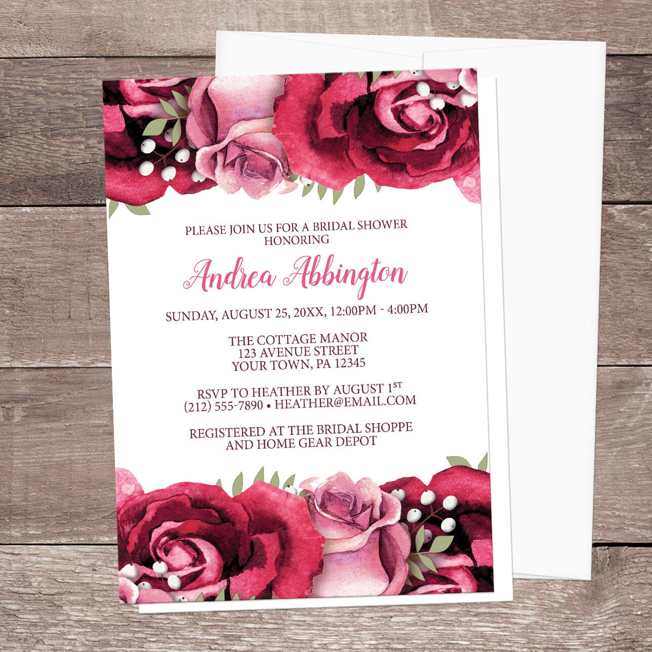 Bridal shower invitation with burgundy and pink roses, shown with an envelope on a wooden surface