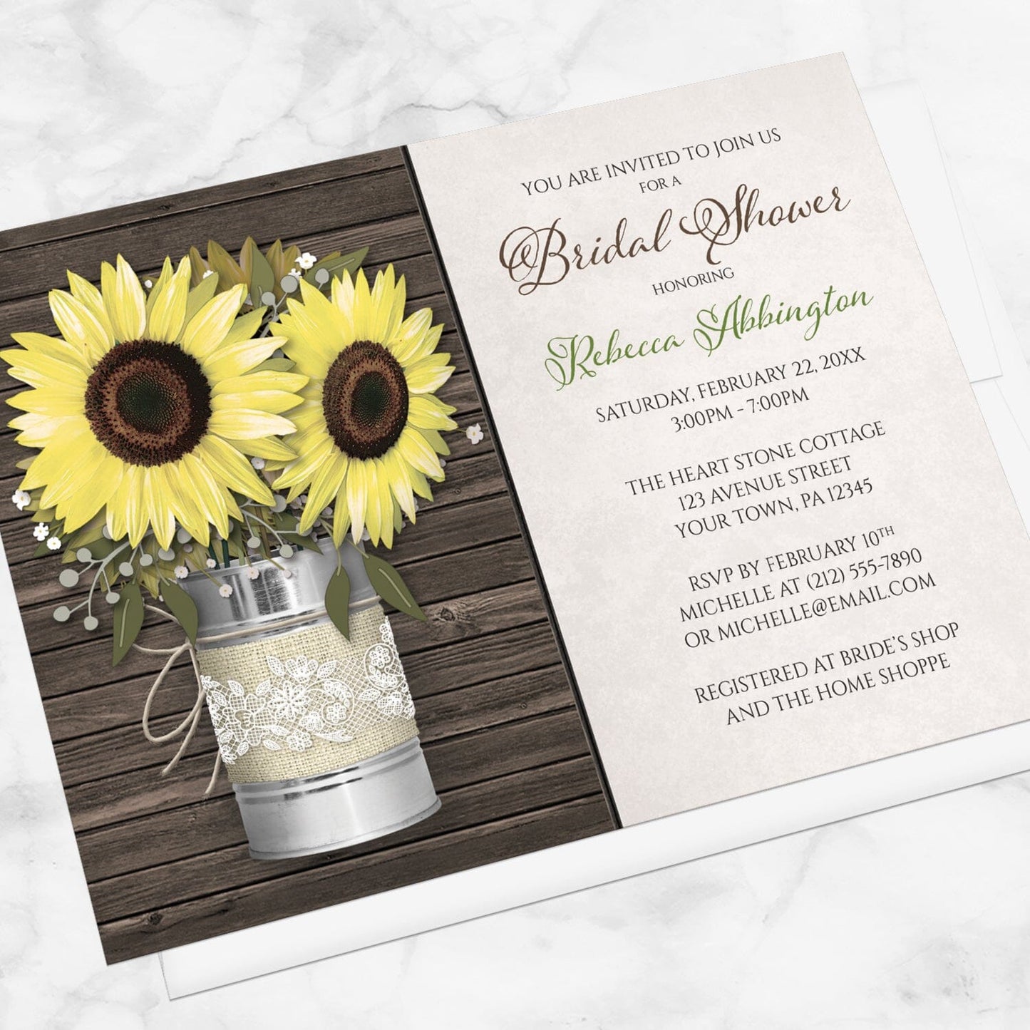 Bridal shower invitation with sunflowers in a tin can on a wooden background, displayed at an angle with a white envelope on a marble surface