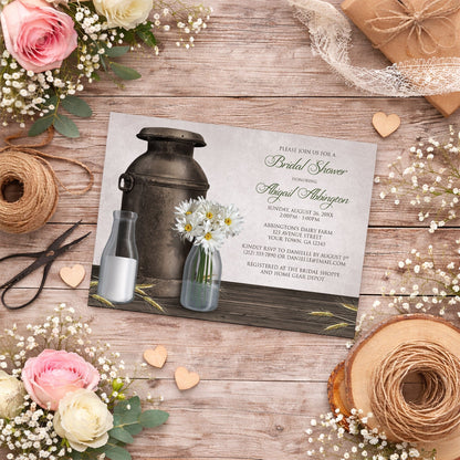 Rustic Country Dairy Farm Bridal Shower Invitation shown on a wooden surface with spring and summer flowers, small wood hearts, and twine.