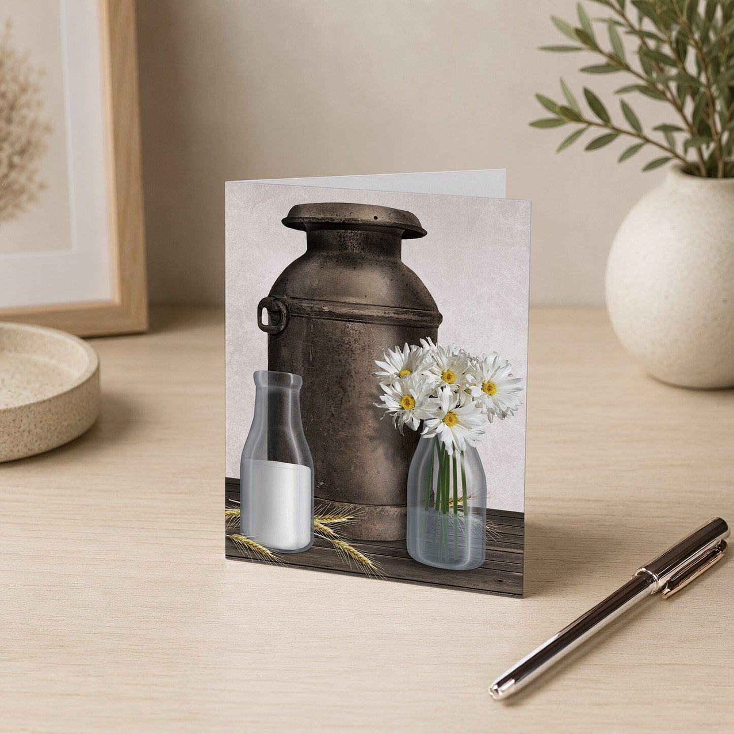 Rustic Country Dairy Farm Note Card shown on a desk with a vase and a pen.