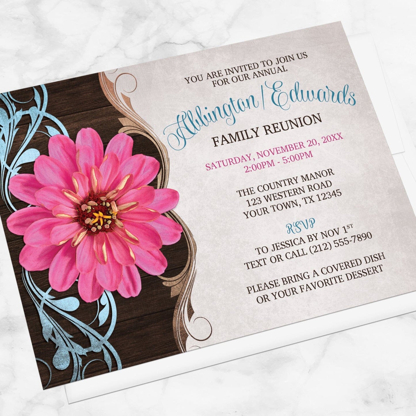 Rustic Country Pink Zinnia Family Reunion Invitation shown at an angle on a marble surface with a white envelope.
