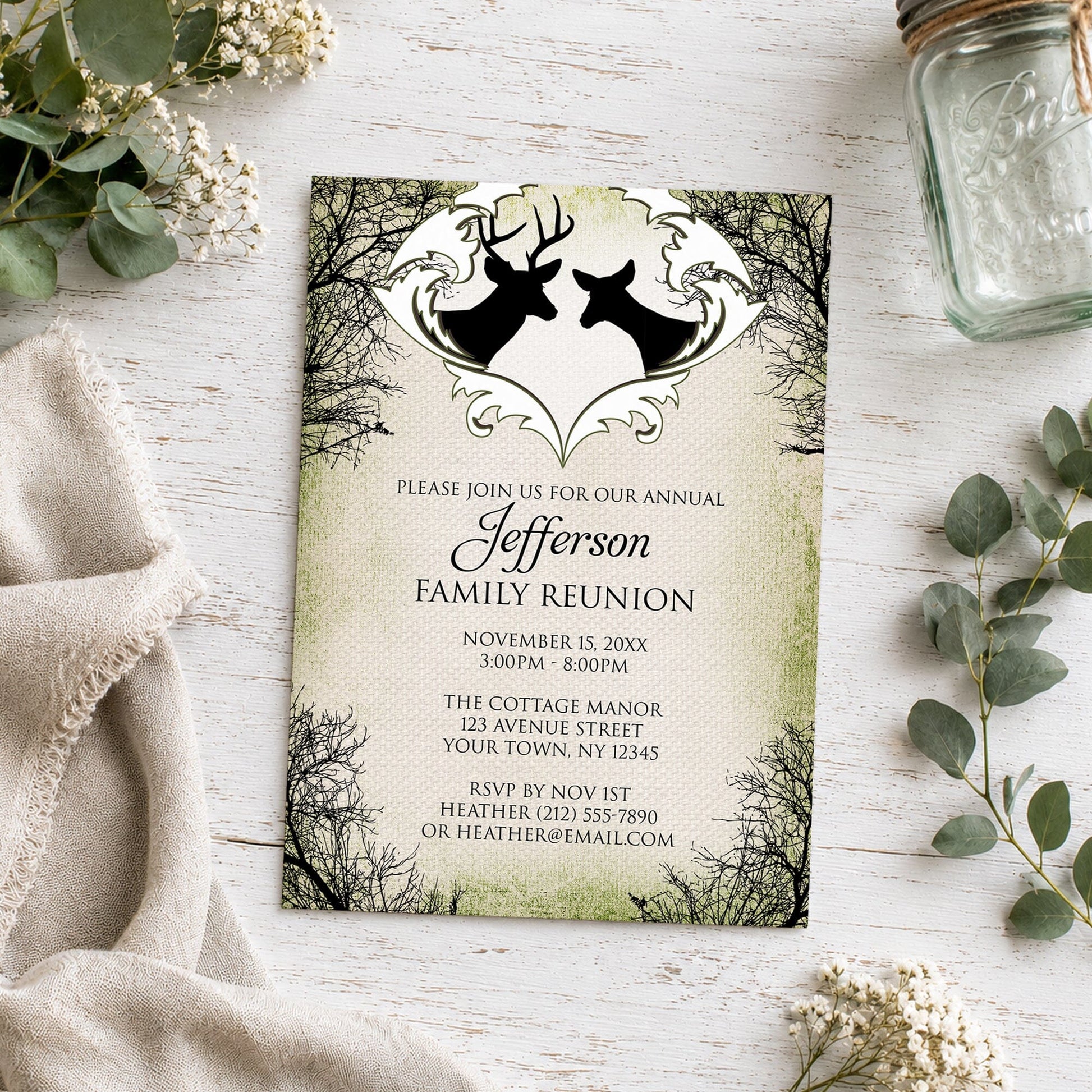 Rustic Deer Frame Canvas Family Reunion Invitation shown on a light wooden surface with plants and a small mason jar.