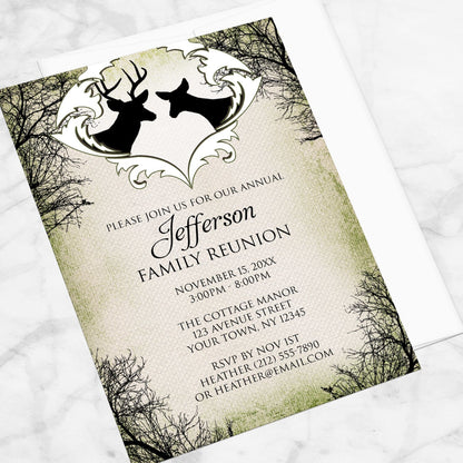 Rustic Deer Frame Canvas Family Reunion Invitation shown at an angle on a marble surface with a white envelope.
