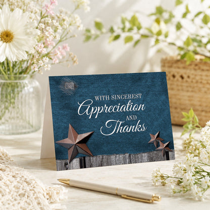 Rustic Denim Country Stars Thank You Card shown on a tabletop with a vase, spring and summer flowers, and a pen.