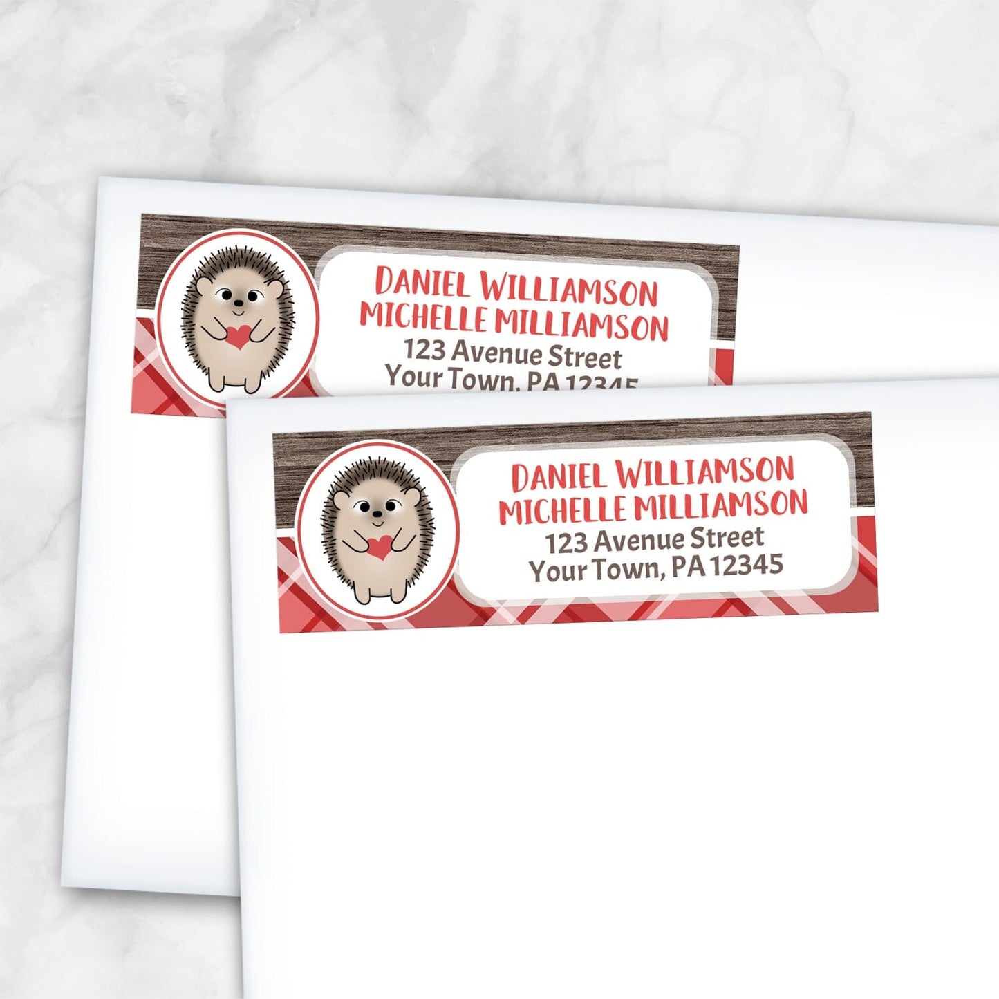 2Rustic Hedgehog Red Plaid Address Labels shown on white envelopes on a marble surface