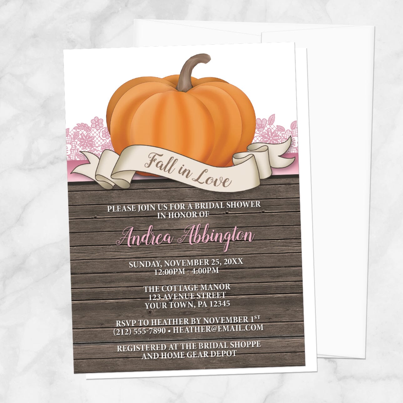 Bridal Shower invitation with a all in Love theme title, orange pumpkin, pink lace, and rustic wood, displayed with a white envelope on a marble surface