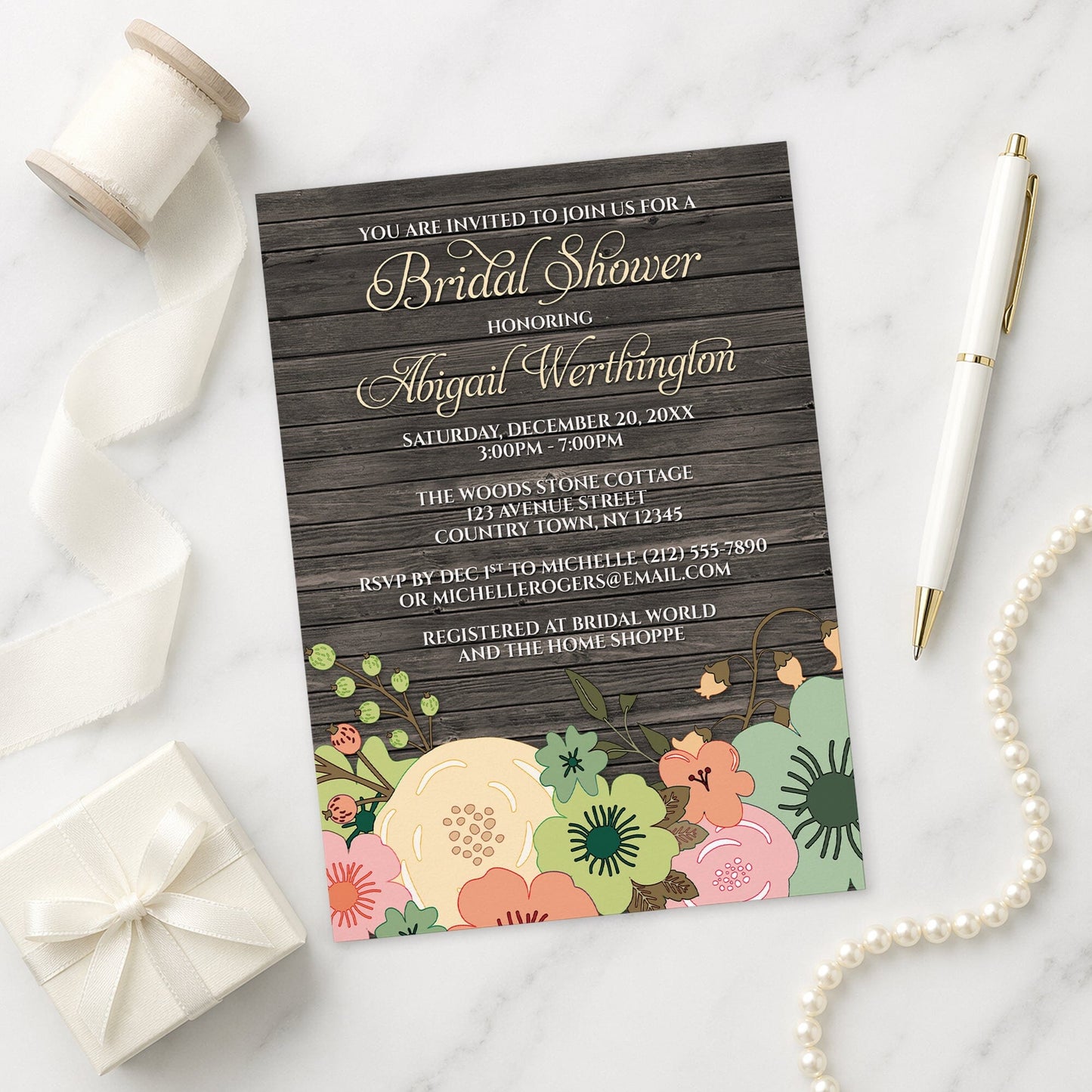 Rustic Orange Teal Floral Wood Bridal Shower Invitation shown on a marble surface with a white gift box, pen, ribbon, and pearls.
