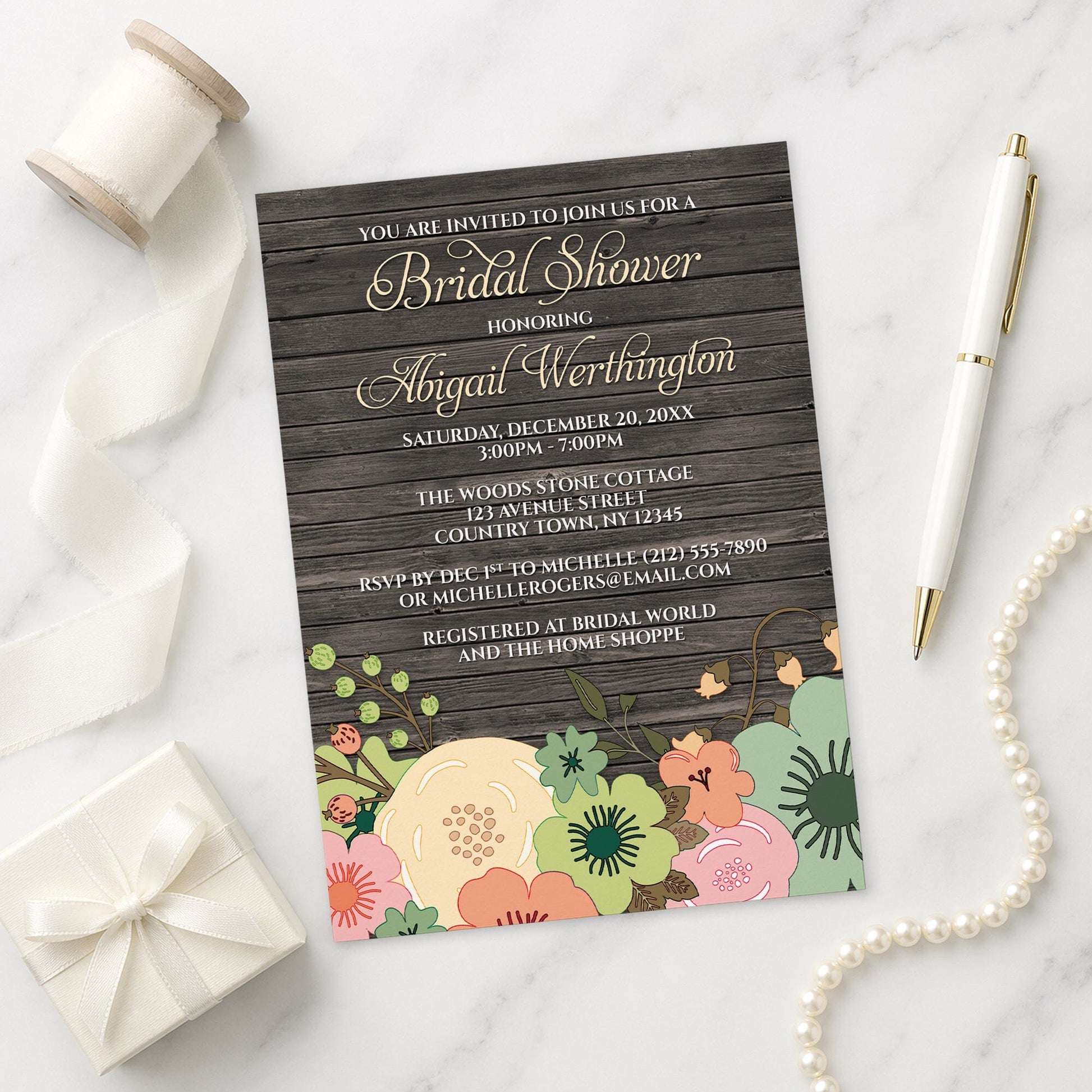 Rustic Orange Teal Floral Wood Bridal Shower Invitation shown on a marble surface with a white gift box, pen, ribbon, and pearls.
