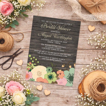 Rustic Orange Teal Floral Wood Bridal Shower Invitation shown on a country-inspired wooden surface with spring and summer flowers, small wood hearts, and twine.