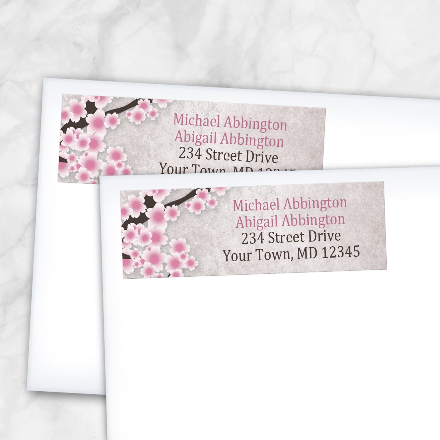 2 Rustic Pink Cherry Blossom Address Labels shown on white envelopes on a marble surface