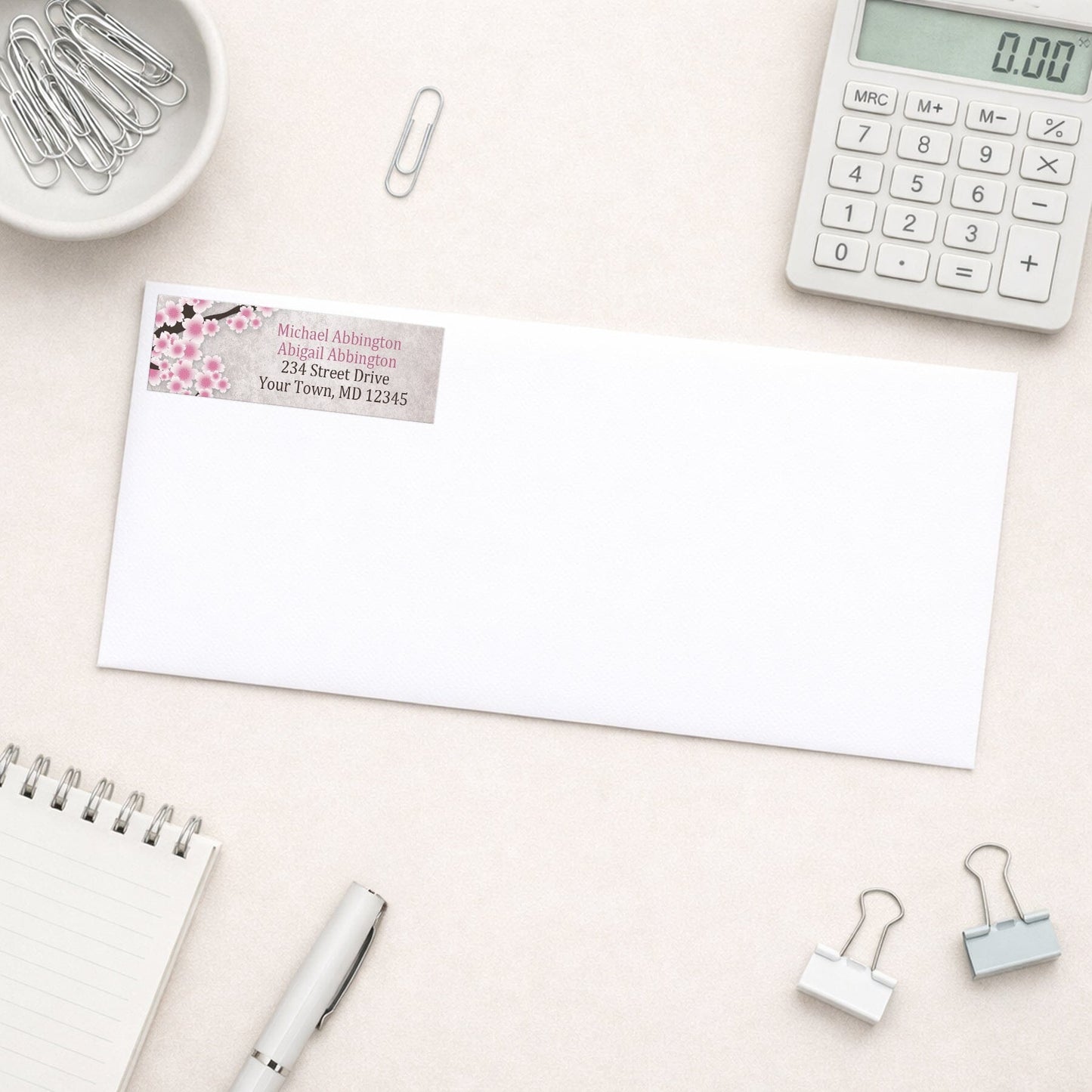 Rustic Pink Cherry Blossom Address Label shown on a white envelope with everyday office supplies