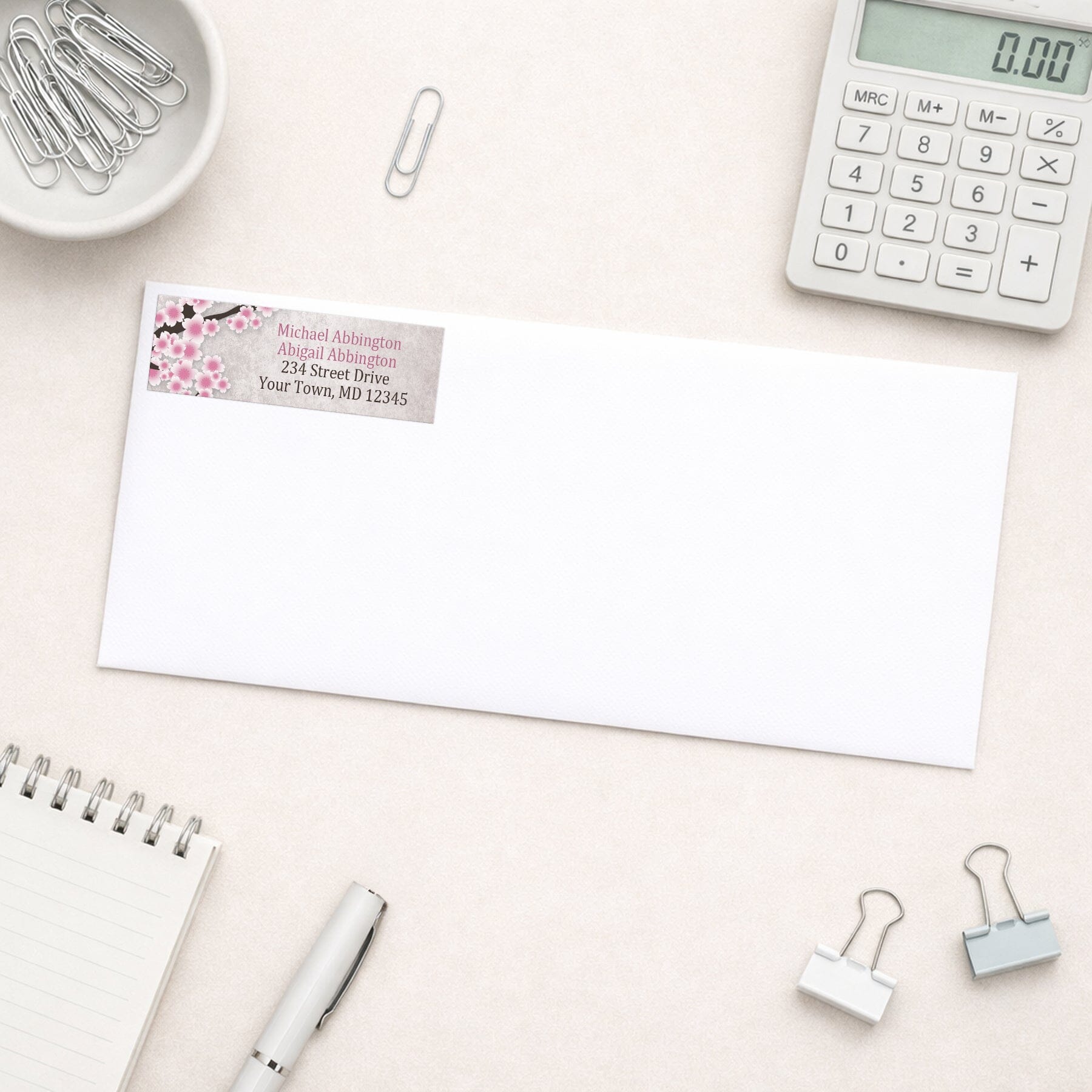 Rustic Pink Cherry Blossom Address Label shown on a white envelope with everyday office supplies