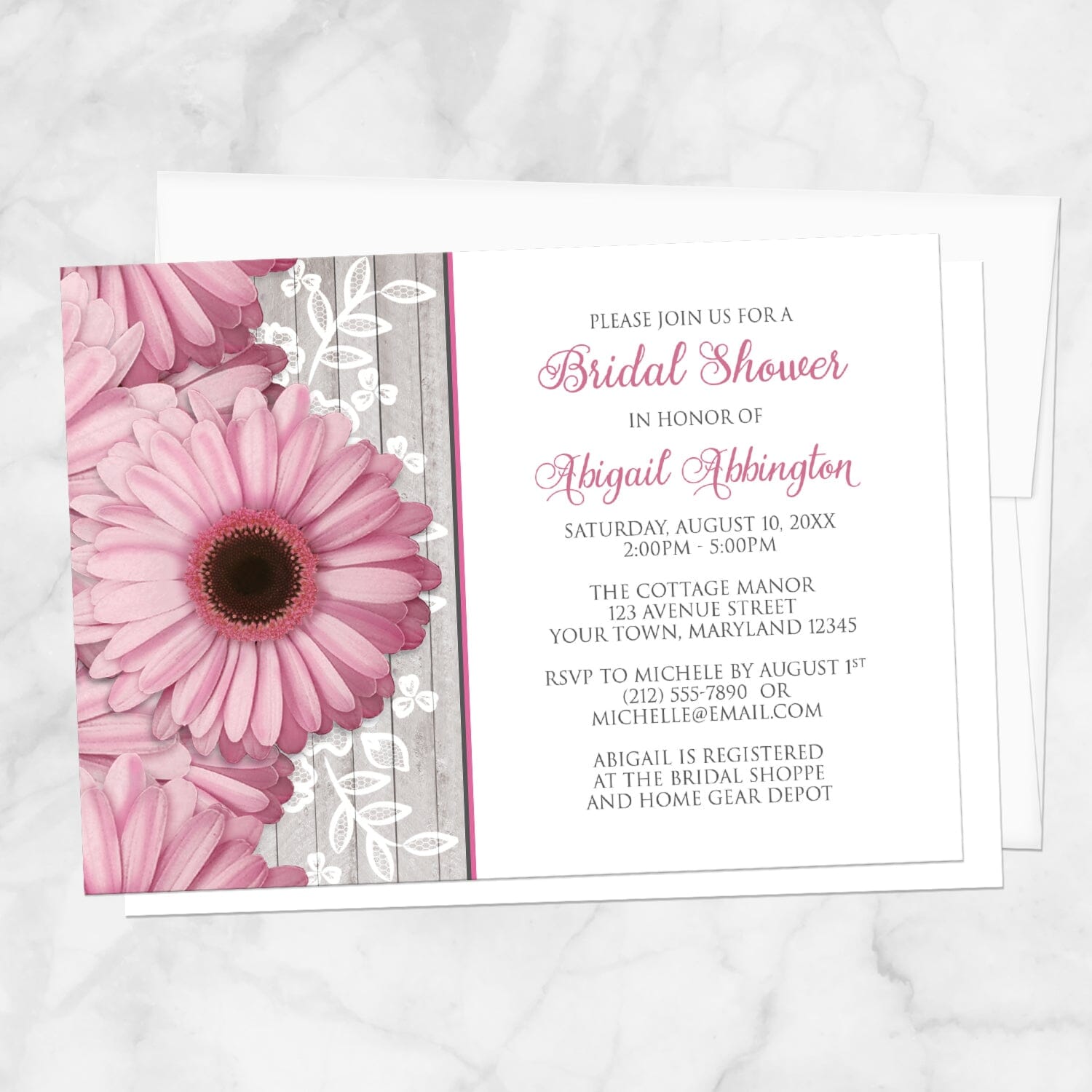 Rustic Pink Daisy Wood White Bridal Shower Invitation shown on a marble surface with a white envelope.