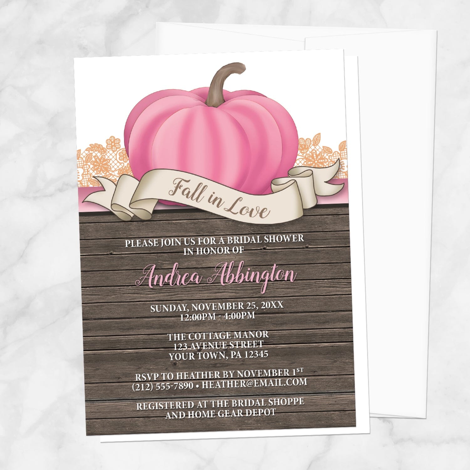 Rustic Pink Pumpkin Fall in Love Bridal Shower Invitation shown on a marble surface with a white envelope.
