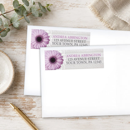 Rustic Purple Daisy Gray Wood Address Labels, shown on white envelopes, on a wooden surface with eucalyptus leaves and a pen.