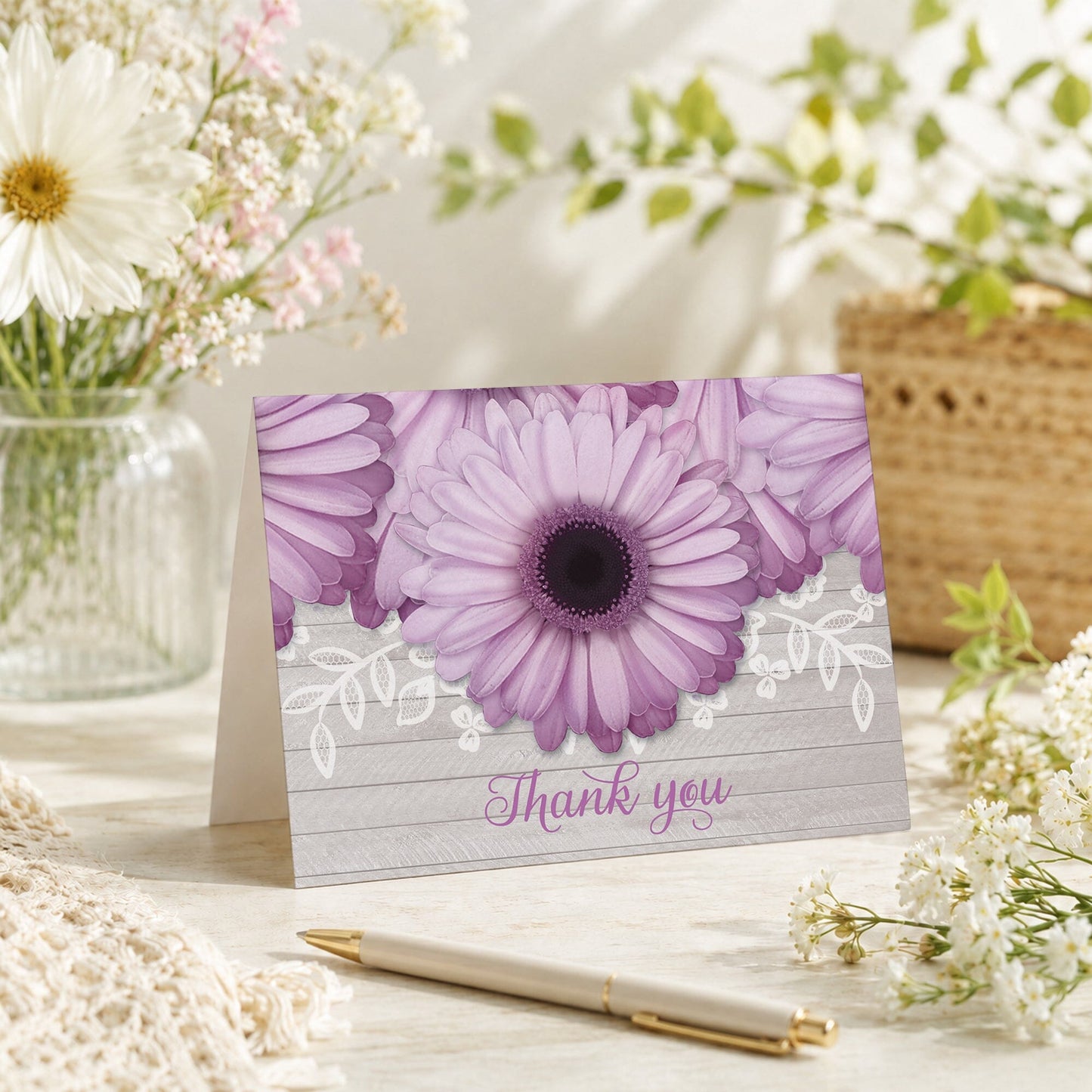Rustic Purple Daisy Gray Wood Thank You Card shown on a tabletop with a vase, spring and summer flowers, and a pen.