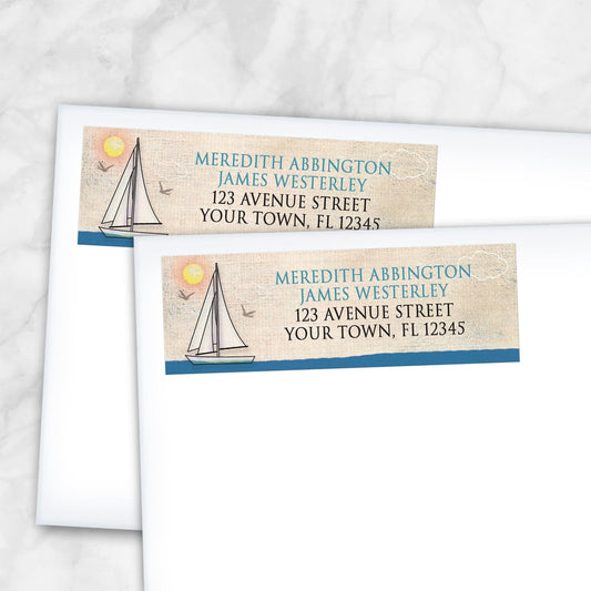 2 Rustic Sailboat Nautical Address Labels shown on white envelopes on a marble surface