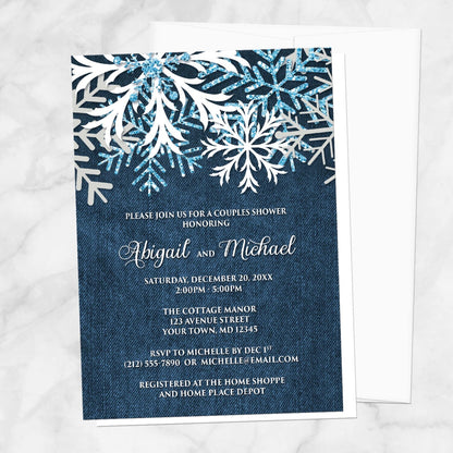 Rustic Snowflake Denim Winter Couples Shower Invitation shown on a marble surface with a white envelope.