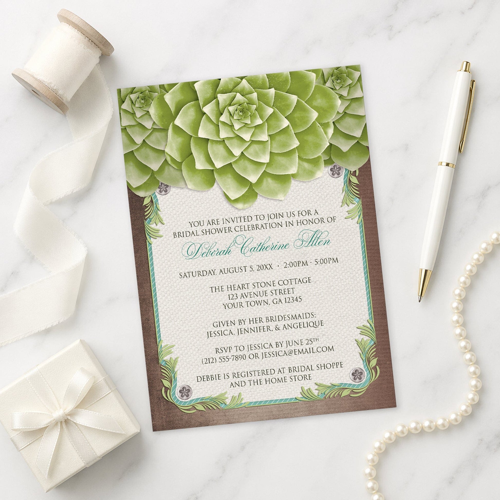 Rustic Succulent Garden Bridal Shower Invitation on a marble surface with ribbon, pen, and gift box.