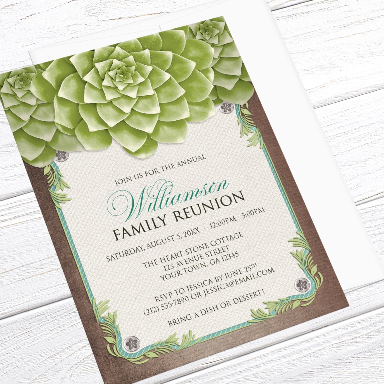 Rustic Succulent Garden Family Reunion Invitation shown at an angle on a light wood surface with a white envelope.