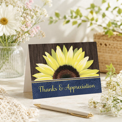 Rustic Sunflower Blue Thank You Card shown on a tabletop with a vase, summer flowers, and a pen.